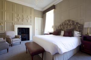 A bed or beds in a room at Headlam Hall Hotel 