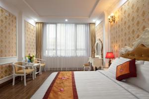 Ένα ή περισσότερα κρεβάτια σε δωμάτιο στο Busan Hotel
