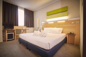 Postel nebo postele na pokoji v ubytování iH Hotels Milano Gioia + 37 fotografií