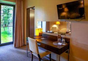 TV a/nebo společenská místnost v ubytování Margis Hotel & SPA