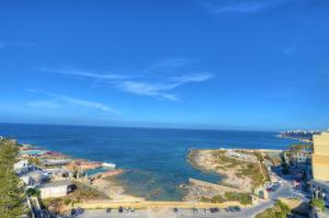 an aerial view of the ocean and a beach at Vivaldi Hotel in St Julian's