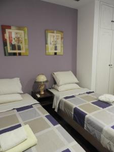 Giường trong phòng chung tại Hotel Casa Jardin