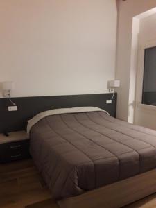 מיטה או מיטות בחדר ב-Locanda Mirafiori