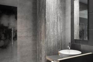 a bathroom with a white sink and a mirror at Petit Palace Plaza Mayor in Madrid +38 photos