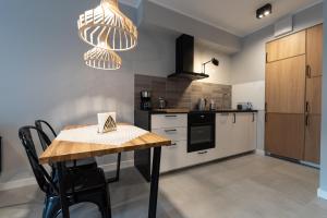 Kuchnia lub aneks kuchenny w obiekcie City Lights Rakowicka 15