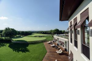 a view of a golf course from a building at Kemer Country Hotel İstanbul in Istanbul