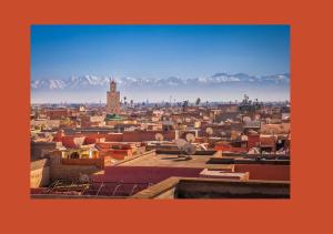 a view of a city with mountains in the background at Marrakech autrement in Marrakesh