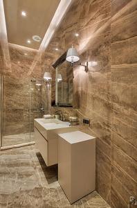 a bathroom with a sink and a shower at Kemer Country Hotel İstanbul in Istanbul