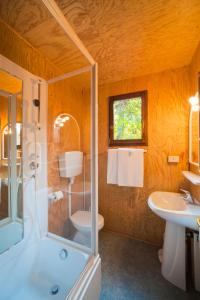 a bathroom with a shower and a sink at Camping Village Capalonga in Bibione