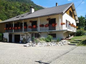 a house with flowers on the balconies of it at Chalet toutou 12/14 personnes in Barèges