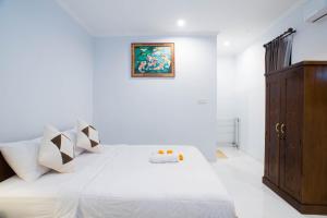 Suntari Homestay客房内的一张或多张床位