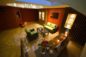 an overhead view of a living room with a table at Mestil Hotel & Residences in Kampala