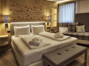 Voodi või voodid majutusasutuse Hotel Bertelli toas