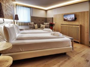 Voodi või voodid majutusasutuse Hotel Bertelli toas