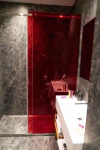 a bathroom with a sink, toilet and mirror at Hotel Milù in Florence