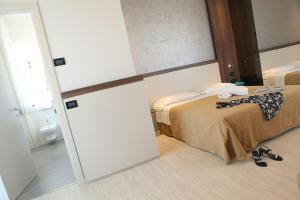 Кровать или кровати в номере Hotel Mondial