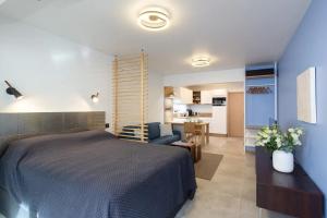 a bedroom with a bed and a living room at Cannes NEW Apartment, Palais Des Festivals, CROISETTE, Beaches in Cannes