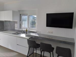Kuchyň nebo kuchyňský kout v ubytování Aestas Apartments