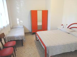 Ein Bett oder Betten in einem Zimmer der Unterkunft Cervia Apartment