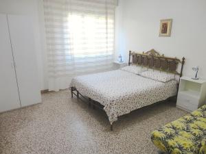 Ein Bett oder Betten in einem Zimmer der Unterkunft Cervia Apartment