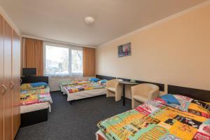 Postel nebo postele na pokoji v ubytování Hotel Buly