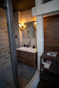 a bathroom with a sink and a mirror at Vysoka Khata 5 in Lviv