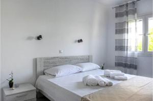 Postel nebo postele na pokoji v ubytování ISSOS BEACH VILLA