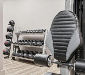 a bench with dumbbells in a gym at Boardwalk Resorts - Flagship in Atlantic City