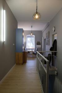 a room with a hallway with a desk and a table at Apartament w centrum Kłodzka in Kłodzko