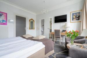 Voodi või voodid majutusasutuse Hotel Dania toas