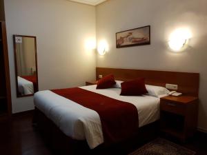 Ein Bett oder Betten in einem Zimmer der Unterkunft Pension Alameda