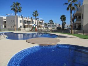 Swimmingpoolen hos eller tæt på Playa Elisa Bay