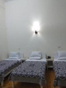 Posteľ alebo postele v izbe v ubytovaní De La Poste