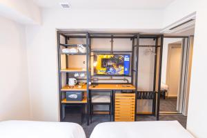 Postel nebo postele na pokoji v ubytování ICI HOTEL Asakusabashi
