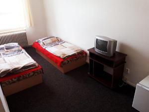Postel nebo postele na pokoji v ubytování Ubytovna Pod Mostem