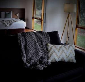 
A bed or beds in a room at Yering Gorge Cottages
