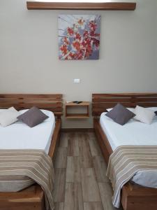 Postel nebo postele na pokoji v ubytování Cahuita Inn