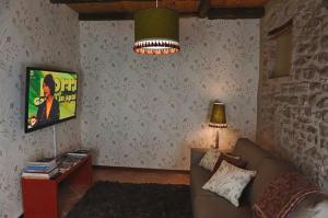 TV a/nebo společenská místnost v ubytování Casetta Al Ponte + 2 fotografie