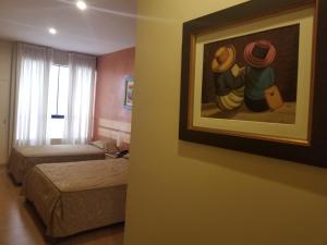 Postel nebo postele na pokoji v ubytování Hotel El Brujo Centro Histórico