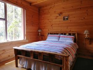 Postel nebo postele na pokoji v ubytování Minnow cabins Lower Beulah
