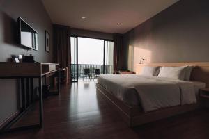 Postel nebo postele na pokoji v ubytování Riverawan Hotel + 37 fotografií