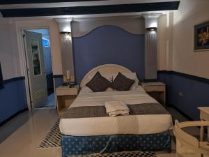 Postel nebo postele na pokoji v ubytování SM Travelodge