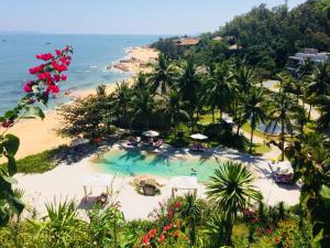 an aerial view of a beach with a swimming pool at Casa Marina Resort in Quy Nhon