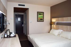 Postel nebo postele na pokoji v ubytování Best Western Marseille Aeroport