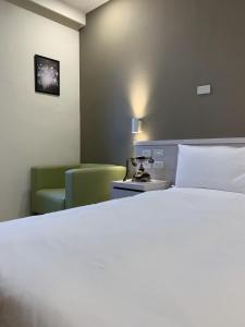 Voodi või voodid majutusasutuse Raise Hotel Taichung toas