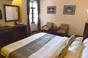 Cama ou camas em um quarto em Hotel Excelsior