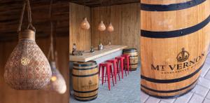 a wine tasting room with a sink and red chairs at Route 40 in Hoedspruit