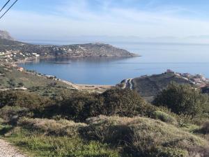 a view of a body of water from a hill at MOTEL KATERINA in Keratea +4 photos
