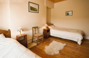 Una cama o camas en una habitación de Castlehouse B&B
