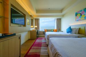 Mercure Penang Beach客房内的一张或多张床位